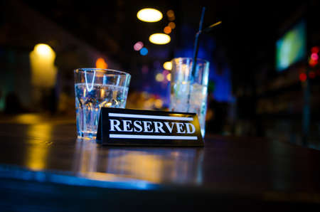 Plastic occupied sign on on bar counterの写真素材