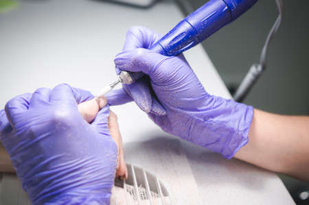 Closeup shot of hardware manicure in a beauty salon