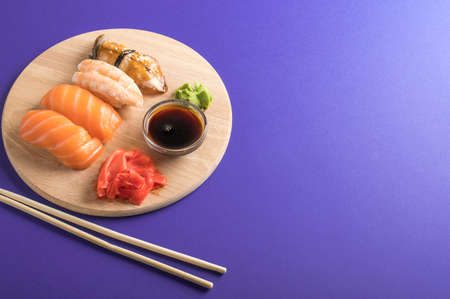 Close up of sashimi sushi set served on wooden plate. Tasty Japanese seafood, restaurant conceptの写真素材