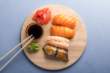 Close up of sashimi sushi set served on wooden plate. Tasty Japanese seafood, restaurant conceptの写真素材
