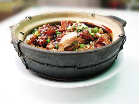 a bowl of clay pot chicken rice, asian style foodの写真素材