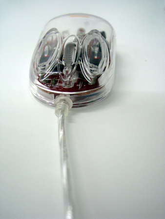 close up for transparent Optical mouse, isolated on whiteの写真素材