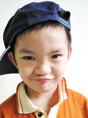 A close up for a asian boy with face expressionの写真素材