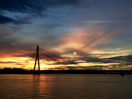 Sunset over river Daugavaの写真素材