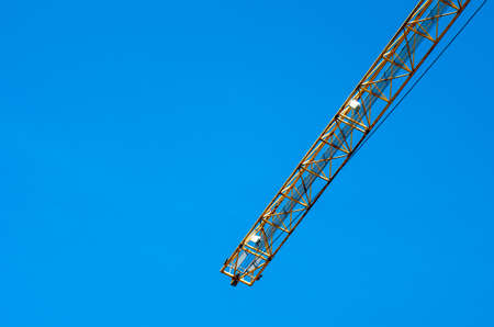 yellow crane towards blue sky