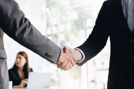Close up of Business people shaking hands, finishing up meeting, business etiquette, congratulation,...
