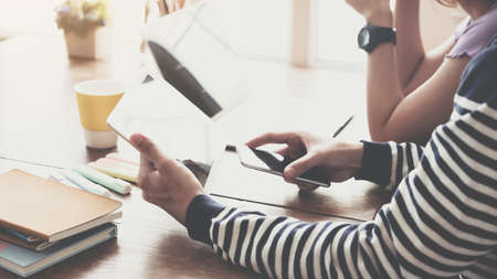team working together. Modern workplace desks and computers and documents, the device is ready for...