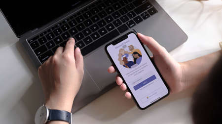 CHIANG MAI, THAILAND - JUL 03  2020 : A working from home employee is downloading the Microsoft Teams social platform, ready for remote working in isolation from homeのeditorial素材