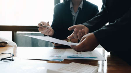 Top view Woman sitting and holding blank screen mock up mobile phoneの写真素材