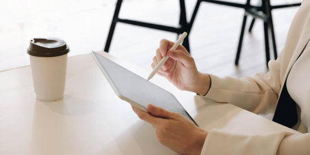 Artist or creative designer drawing on digital tablet with new project design.