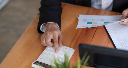 business advisor showing plan of investment to clients in the consultancy office