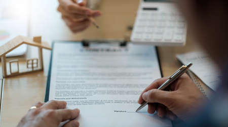 Close up woman signing contract, job agreement, female client putting signature on legal documents,...