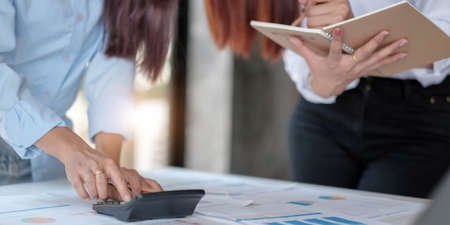 Application for jobs and interviews concept, female is hoping for a resume and recruiter considering application, hr manager making hiring decision.の写真素材