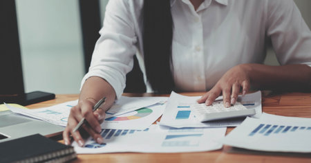 Auditor or internal revenue service staff, Business women checking annual financial statements of company.の写真素材