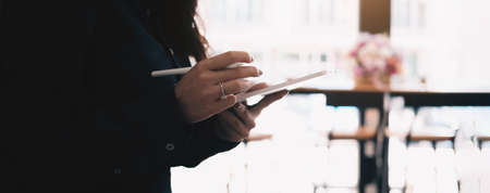 Close-up of asian customer using his credit card to swipe with EDC to pay, shopping with credit card conceptの写真素材