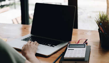 Online class, Student writing on notebook while study at home, Adult woman doing online lesson by...