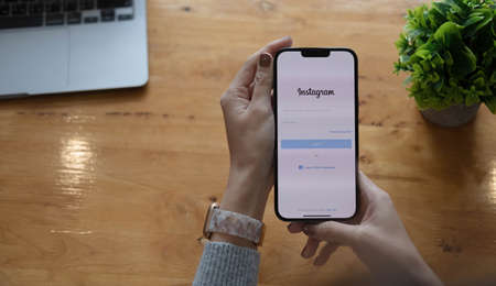 CHIANG MAI, THAILAND, OTC 14, 2021 : A women holds Apple iPhone Xs with LinkedIn application on the screen.LinkedIn is a photo-sharing app for smartphones.のeditorial素材