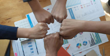 Real estate broker and customer shaking hands after signing a contract: real estate, home loan and...