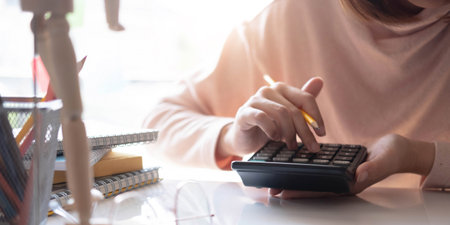 Closeup banner asian woman writing on notebook on table with laptop, girl work at coffee shop, freelance business concept.の写真素材