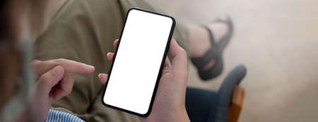 Close up girl pointing finger on screen smart phone on blur background text mobile, mock up glitter...