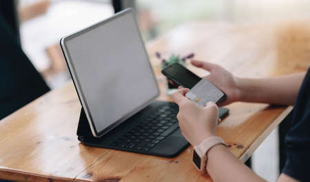 Online payment, Man's hands holding a credit card and using smartphone and choose some product what...