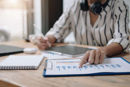 woman financial inspector and secretary making report calculating balance. Internal Revenue Service...