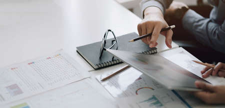 Close up hand of woman using smartphone at office.の写真素材