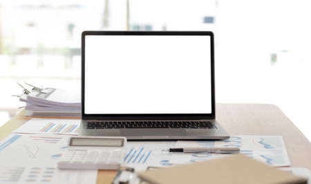 Blank screen desktop computer in minimal office room with decorations and copy space