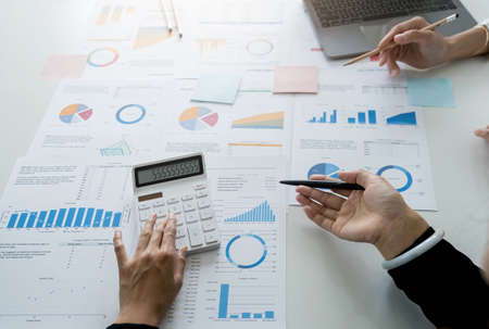 Business team analyzing income charts and graphs with modern laptop computer. Close up.Business analysis and strategy concept.の写真素材