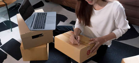 Successful Woman Entrepreneur With Parcel Boxes In Her Own Job Shopping Online Business At Home