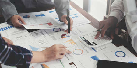 Meeting concept Business team hands at working with financial plan, meeting, discussion, brainstorm...