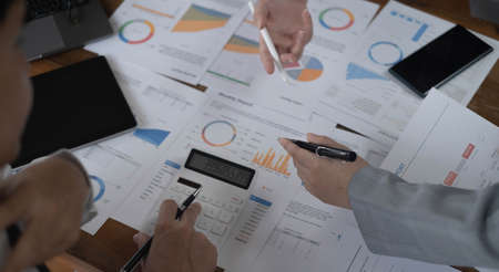 Meeting concept Business team hands at working with financial plan, meeting, discussion, brainstorm...