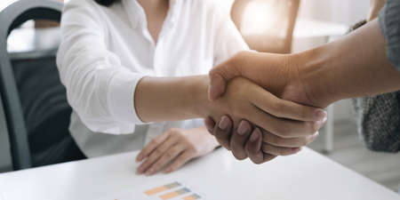 Close up young business people putting their hands together. Stack of hands. Unity and teamwork...