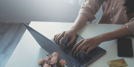 Buying and selling houses and real estate prices concept. woman using calculator to count rent,...