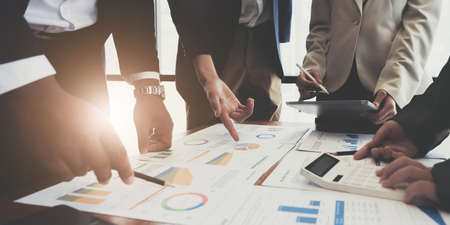 Business team analyzing income charts and graphs with modern laptop computer. Close up.Business analysis and strategy concept.の写真素材