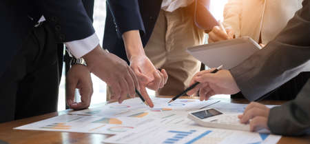 Business team analyzing income charts and graphs with modern laptop computer. Close up.Business analysis and strategy concept.の写真素材