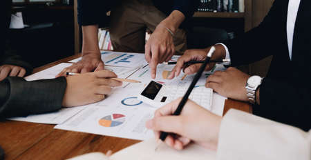 Business team analyzing income charts and graphs with modern laptop computer. Close up.Business analysis and strategy concept.の写真素材