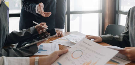 Team of business people working together in the meeting room office, teamwork background charts and graphs banner, double exposure successful teamwork,business planning concept.の写真素材