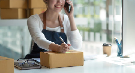 Small start-up business owners using computers and phones at work, salespeople, checking production...