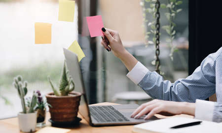 Hands holding credit card and using mobile smart phone with morning, Online shopping.の写真素材