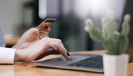 Hands holding credit card and using mobile smart phone with morning, Online shopping.