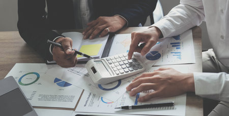 Business people are meeting for analysis data figures to plan business strategies. Business...