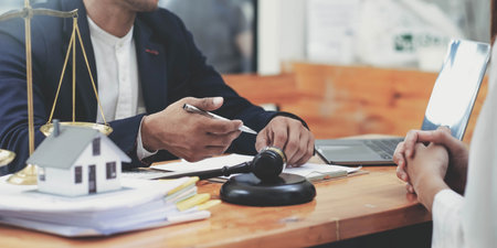 business people and lawyers discussing contract papers sitting at the table. Concepts of law,...