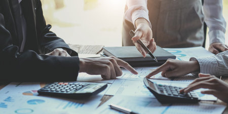 Business people are meeting for analysis data figures to plan business strategies. Business...