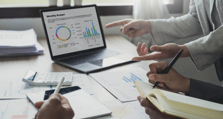 Business people are meeting for analysis data figures to plan business strategies. Business...