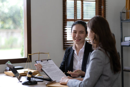business people and lawyers discussing contract papers sitting at the table. Concepts of law, advice, legal services, legal and judgment conceptの写真素材