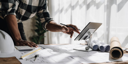 close up view of business people having consultation about wind energy at company office. Businessman discussing about windmill and alternative green enery.の写真素材