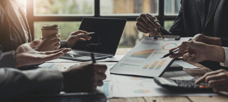 Asian business adviser meeting to analyze and discuss the situation on the financial report in the meeting room.Investment Consultant,Financial Consultant,Financial advisor and accounting conceptの写真素材