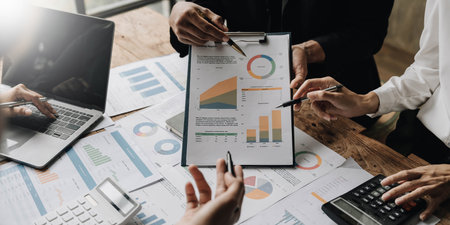 Asian business adviser meeting to analyze and discuss the situation on the financial report in the meeting room.Investment Consultant,Financial Consultant,Financial advisor and accounting conceptの写真素材