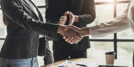 Business people shaking hands, finishing up meeting, business etiquette, congratulation, merger and...